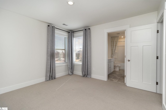 100 Outback Dr, Greer, SC 29650 - unfurnished bedroom with visible vents, light colored carpet, connected bathroom, and baseboards
