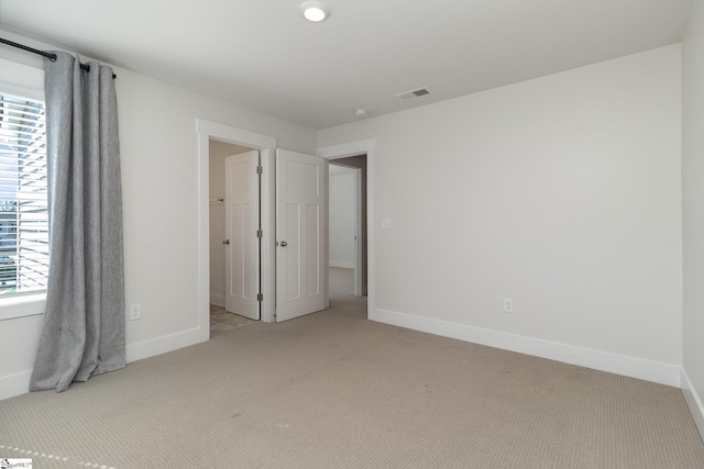 100 Outback Dr, Greer, SC 29650 - unfurnished bedroom with light colored carpet, visible vents, and baseboards