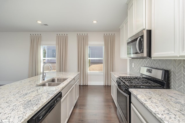 100 Outback Dr, Greer, SC 29650 - kitchen with light stone countertops, dark wood-style floors, a sink, appliances with stainless steel finishes, and tasteful backsplash