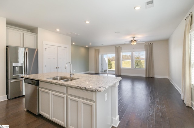100 Outback Dr, Greer, SC 29650 - kitchen with visible vents, dark wood-type flooring, a center island with sink, a sink, and appliances with stainless steel finishes