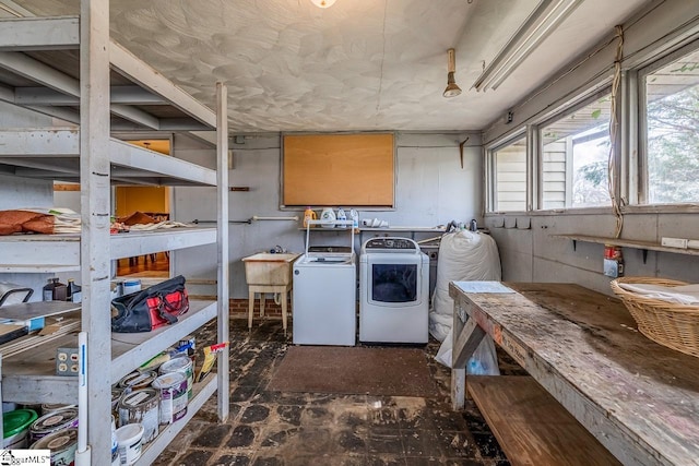 laundry room featuring a sink, laundry area, and washing machine and clothes dryer