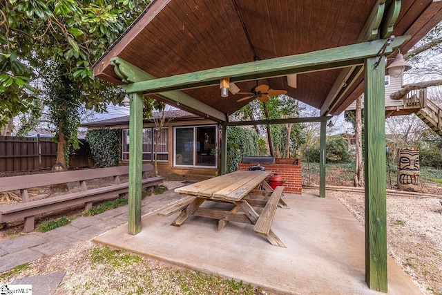 view of patio / terrace featuring a ceiling fan, outdoor dining area, and fence