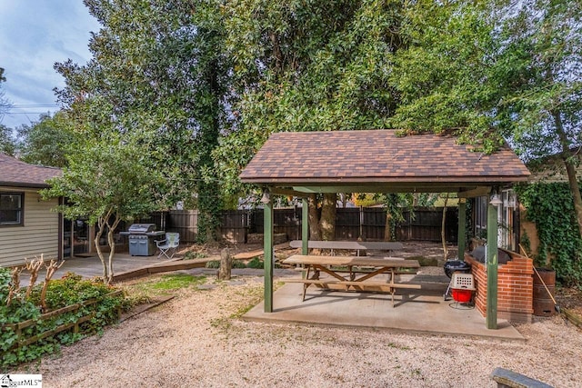 exterior space with a patio area and a fenced backyard