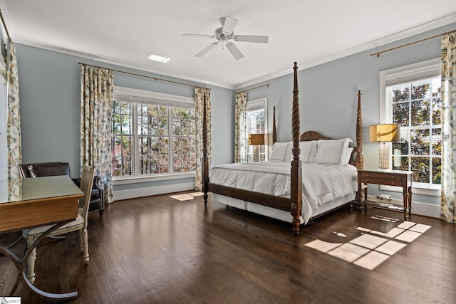 bedroom with ceiling fan, wood finished floors, baseboards, and ornamental molding