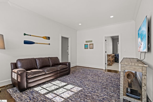 living area with recessed lighting, wood finished floors, baseboards, and ornamental molding