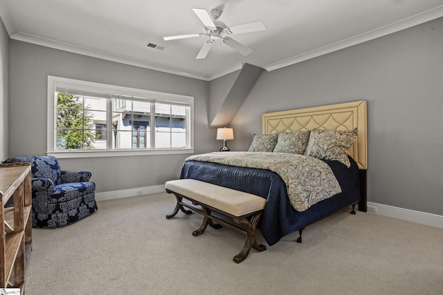 carpeted bedroom featuring crown molding, baseboards, visible vents, and ceiling fan