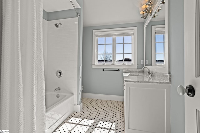 bathroom with shower / bathtub combination with curtain, baseboards, toilet, and vanity