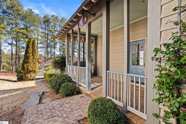 view of property exterior featuring covered porch