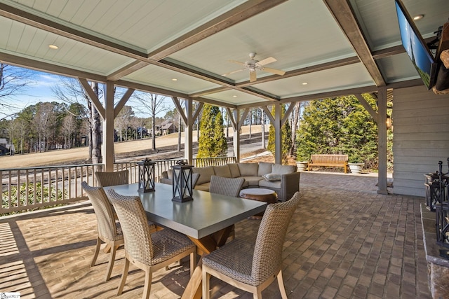 view of patio featuring an outdoor hangout area, outdoor dining area, and ceiling fan