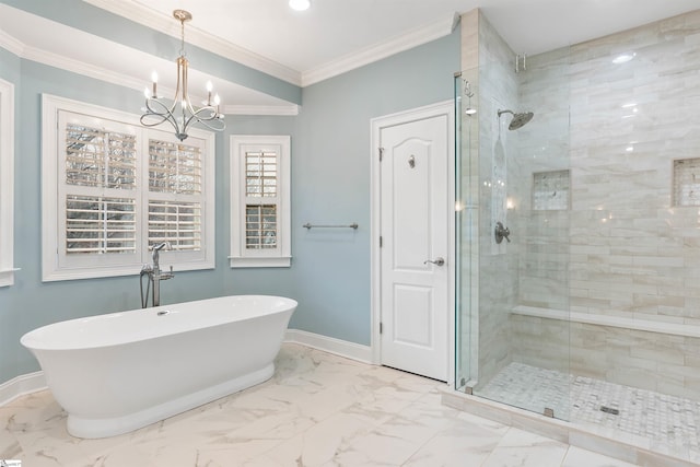 bathroom featuring baseboards, a soaking tub, a shower stall, crown molding, and marble finish floor