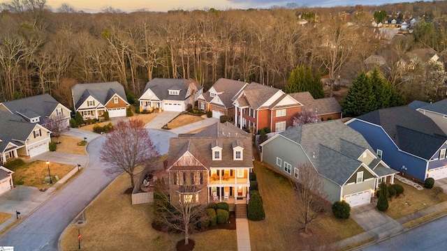 birds eye view of property with a residential view