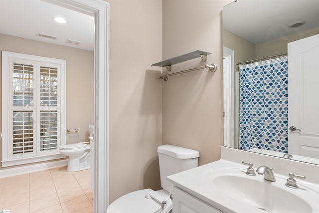 full bathroom with tile patterned flooring, toilet, vanity, and visible vents