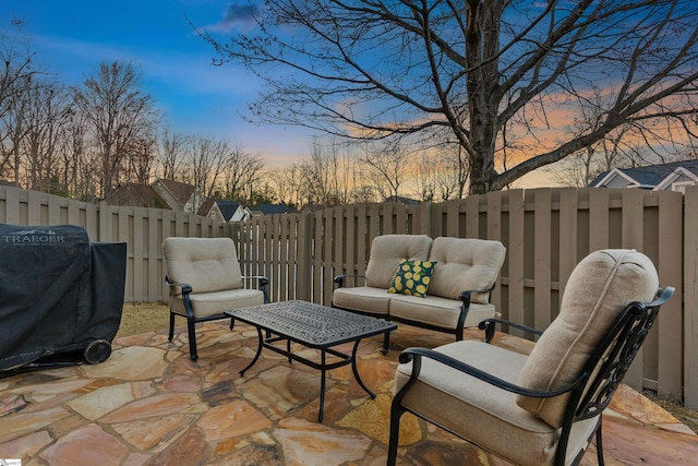 view of patio / terrace featuring an outdoor living space, area for grilling, and fence