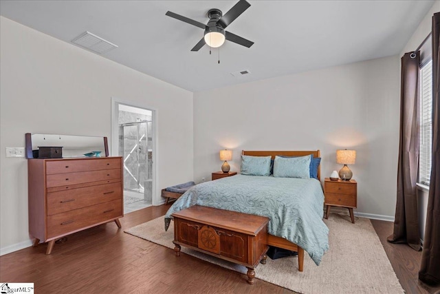 bedroom with visible vents, ceiling fan, baseboards, and wood finished floors