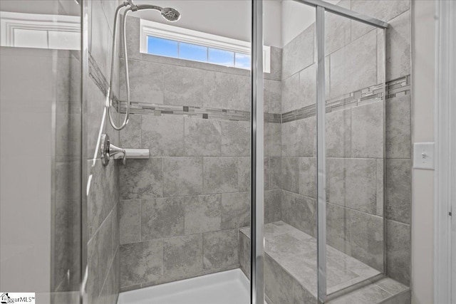 full bath with a shower stall