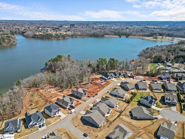 drone / aerial view with a residential view and a water view