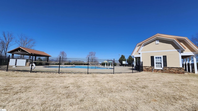 community pool featuring a gazebo and fence