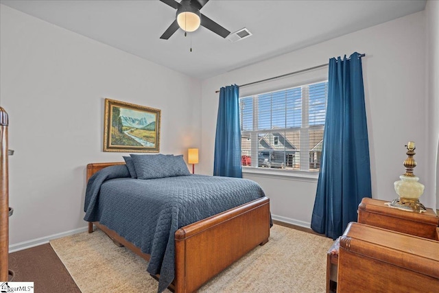 bedroom featuring visible vents, baseboards, and a ceiling fan