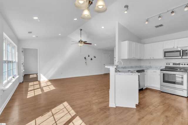 kitchen featuring a sink, visible vents, appliances with stainless steel finishes, and white cabinets