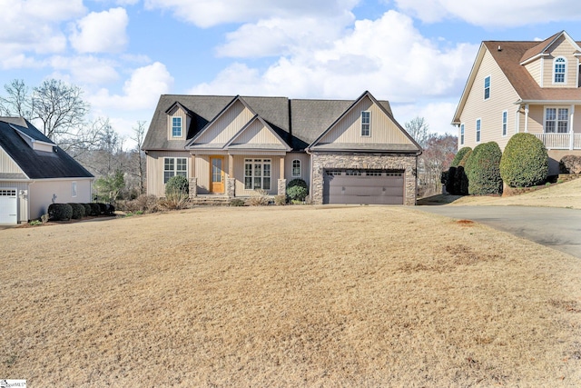 view of front of house featuring board and batten siding, concrete driveway, and a garage