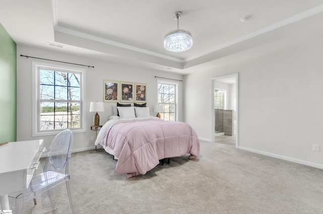 bedroom featuring visible vents, baseboards, a tray ceiling, carpet flooring, and an inviting chandelier