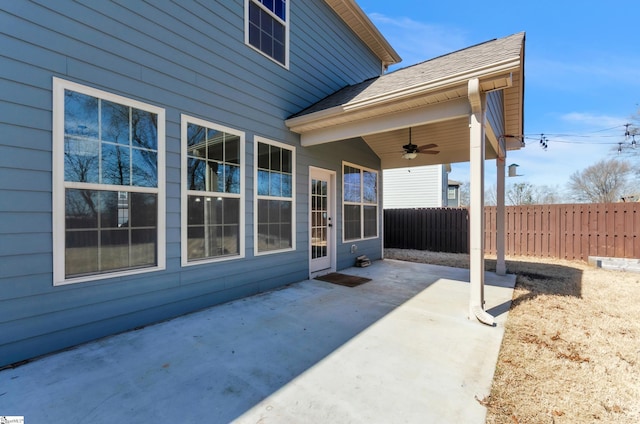 view of patio with a ceiling fan and fence