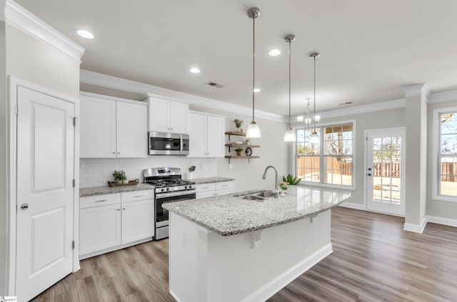 kitchen with ornamental molding, a sink, open shelves, backsplash, and stainless steel appliances