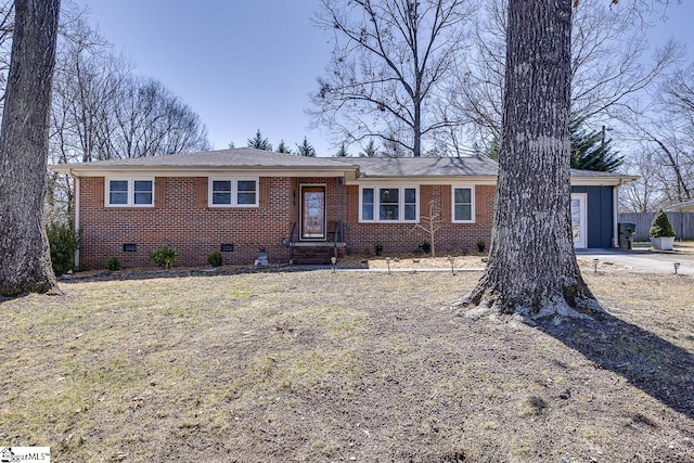 single story home with crawl space, a garage, concrete driveway, and brick siding