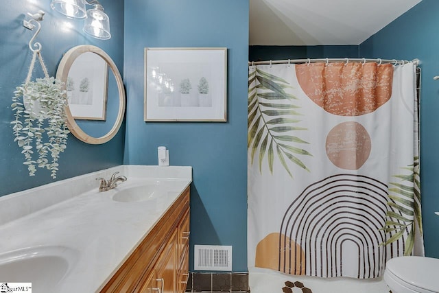 full bathroom with a shower with curtain, visible vents, double vanity, a sink, and toilet