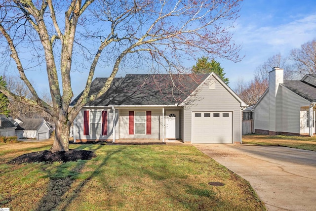 ranch-style home featuring concrete driveway, a garage, and a front yard