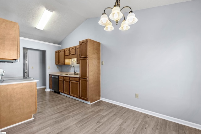 kitchen featuring a sink, stainless steel dishwasher, light wood-style floors, light countertops, and vaulted ceiling