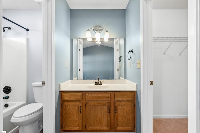 bathroom featuring a spacious closet, visible vents, toilet, vanity, and  shower combination