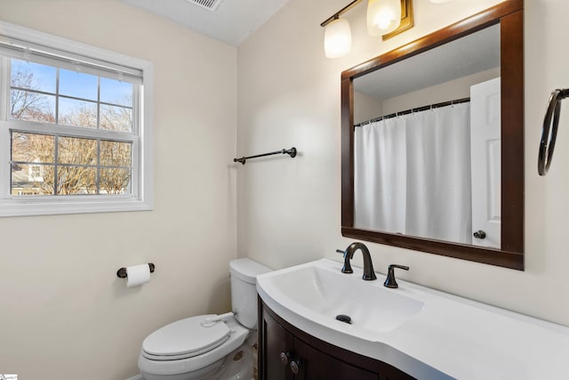 full bath with vanity and toilet