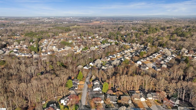 bird's eye view featuring a forest view and a residential view