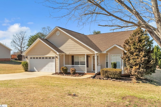 view of front of house with a shingled roof, a front lawn, concrete driveway, covered porch, and a garage