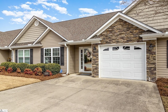 view of front facade featuring a garage, stone siding, roof with shingles, and driveway