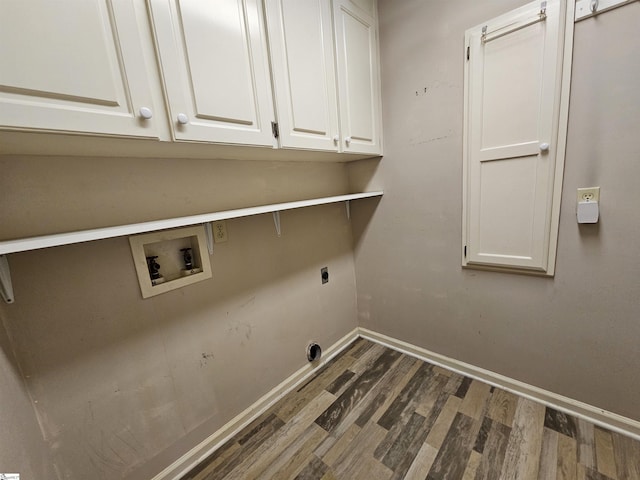 clothes washing area with dark wood-style floors, cabinet space, baseboards, hookup for an electric dryer, and hookup for a washing machine