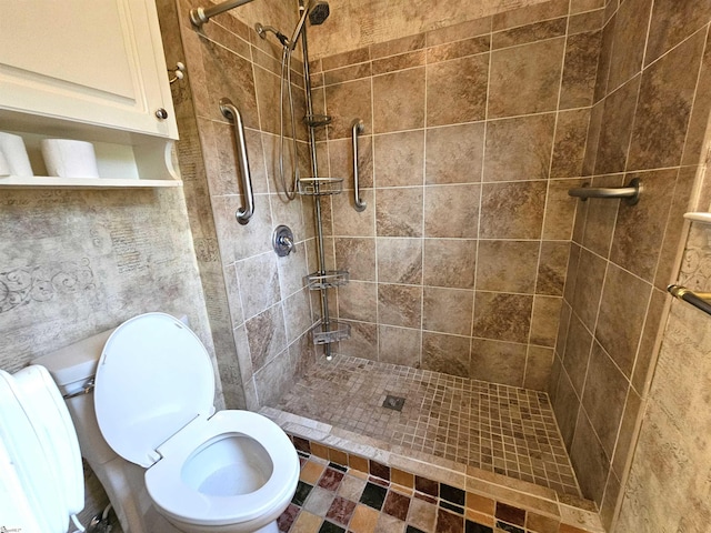 bathroom with tiled shower and toilet