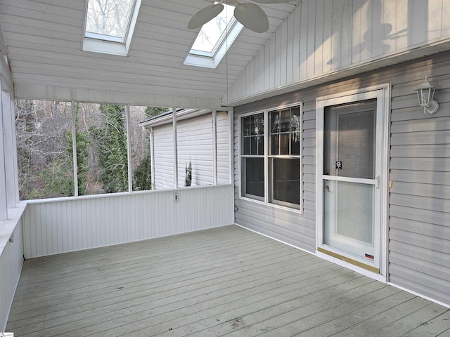 unfurnished sunroom featuring lofted ceiling and ceiling fan