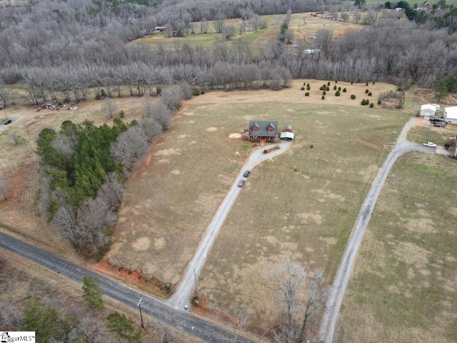 birds eye view of property featuring a rural view