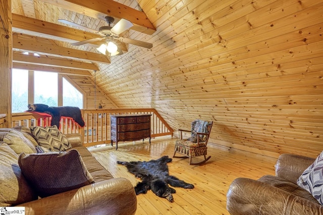 living room with hardwood / wood-style flooring, wooden walls, vaulted ceiling with beams, and wooden ceiling