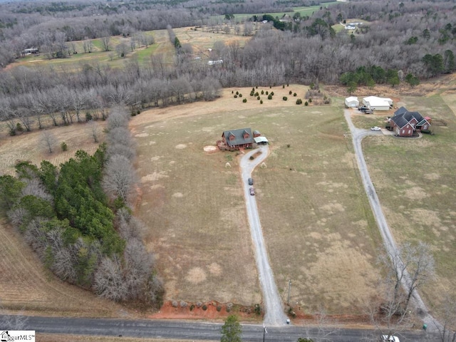 birds eye view of property with a rural view