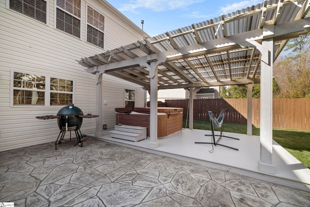 view of patio / terrace with a grill, a hot tub, fence, and a pergola