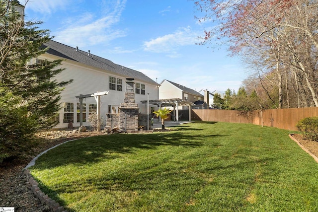 view of yard with fence and a pergola