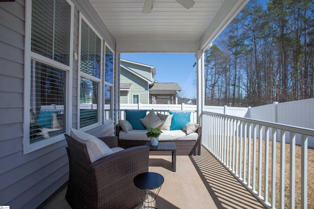 balcony with ceiling fan and an outdoor hangout area