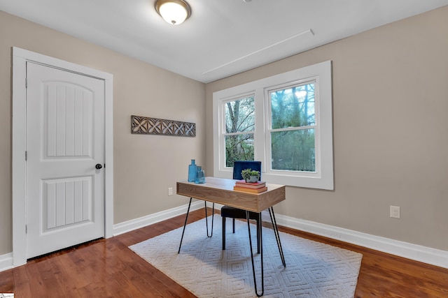 office featuring baseboards and dark wood-style flooring