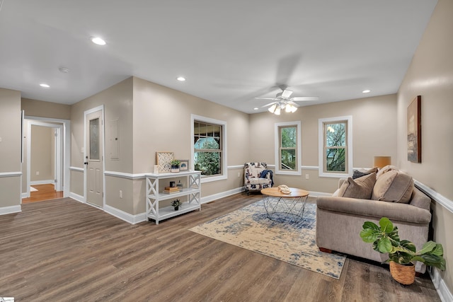 living area featuring recessed lighting, baseboards, wood finished floors, and a ceiling fan