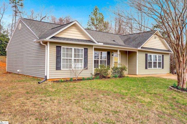 single story home with a front lawn and a shingled roof