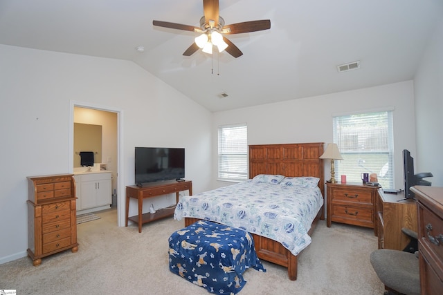 bedroom featuring visible vents, baseboards, ceiling fan, vaulted ceiling, and light carpet