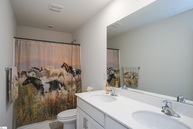 full bath with a sink, visible vents, toilet, and double vanity